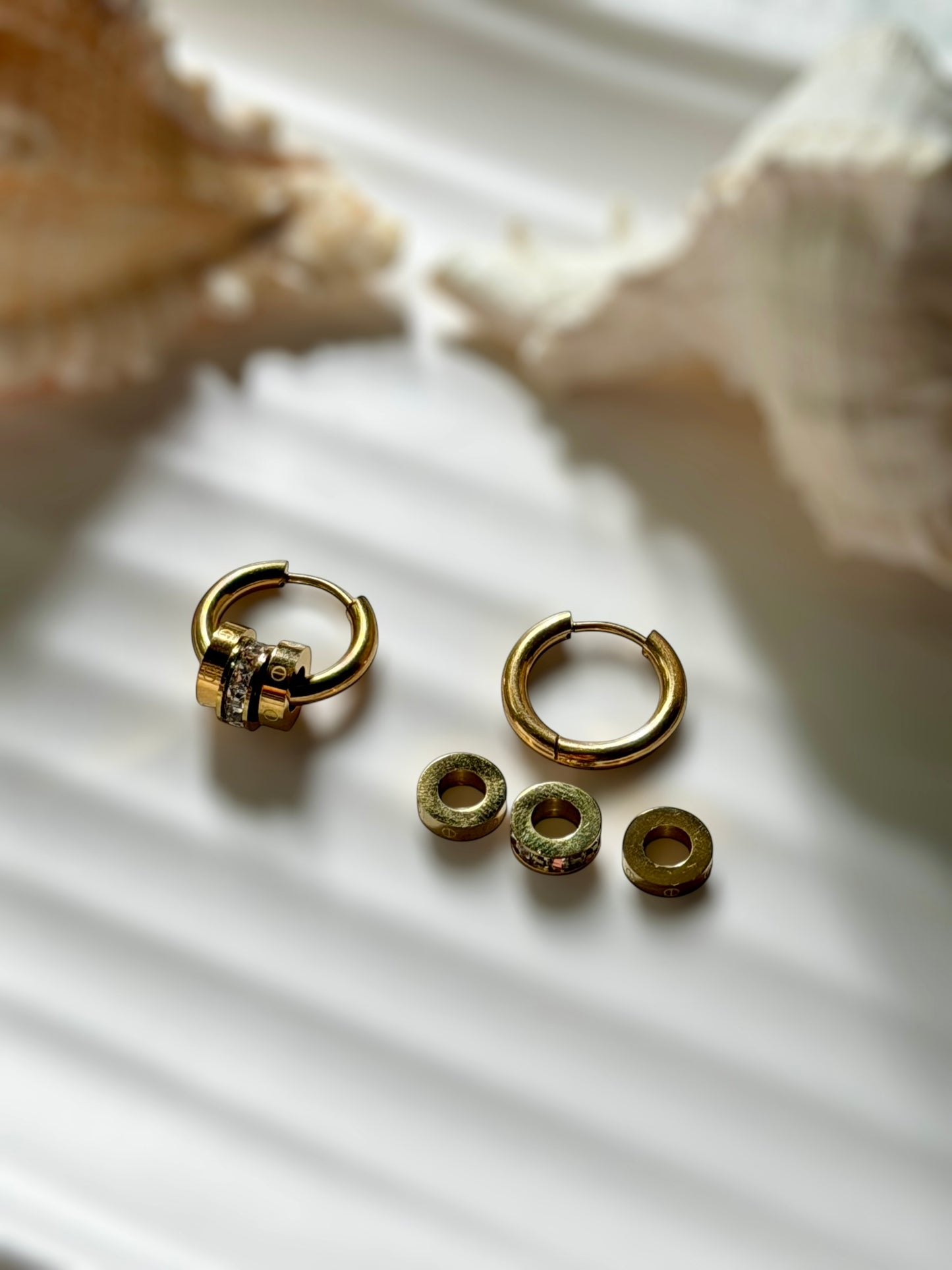 Tiered emblem earrings
