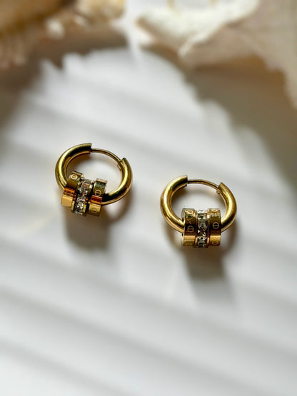Tiered emblem earrings