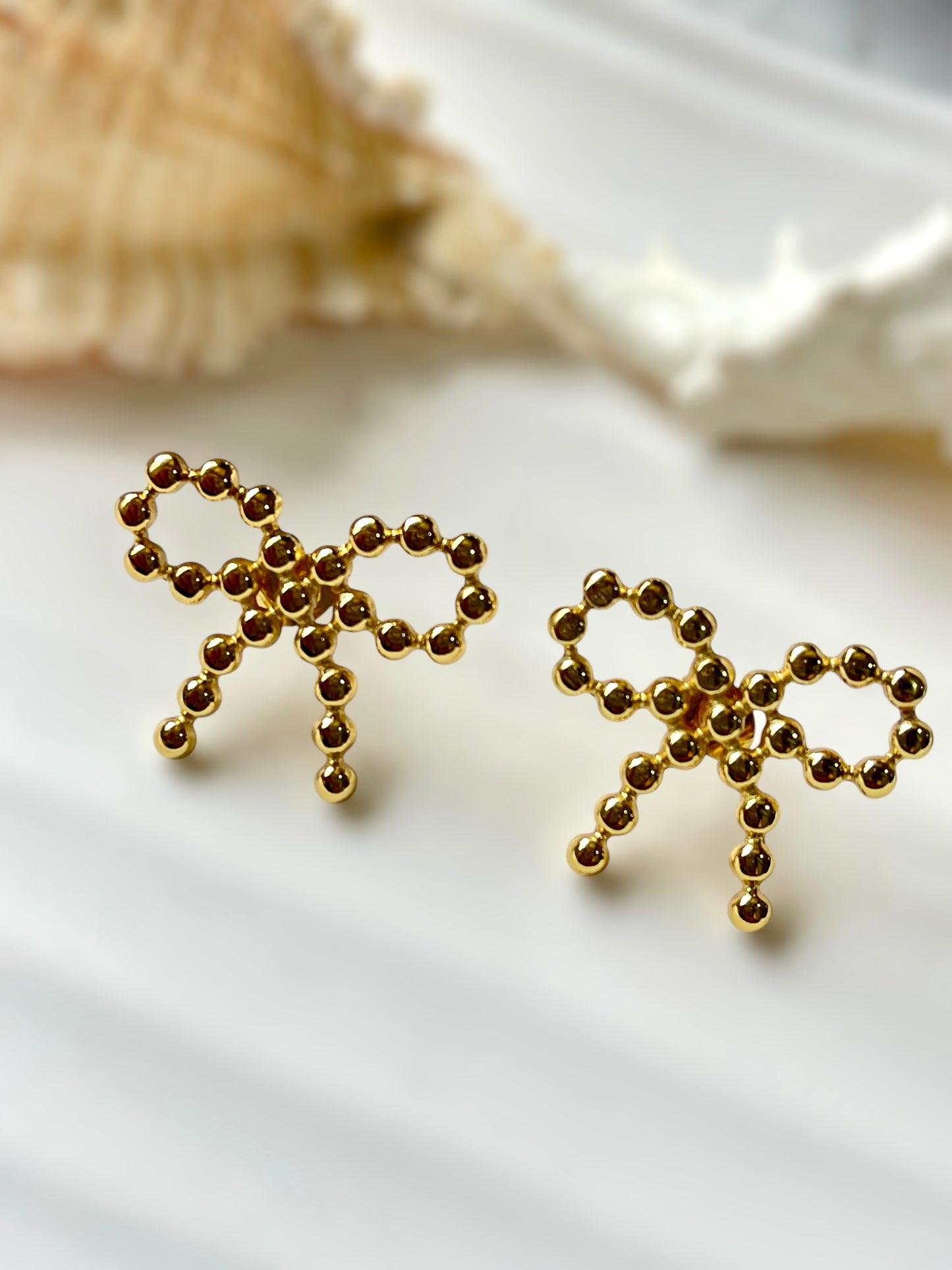 Rosette Wink Earrings